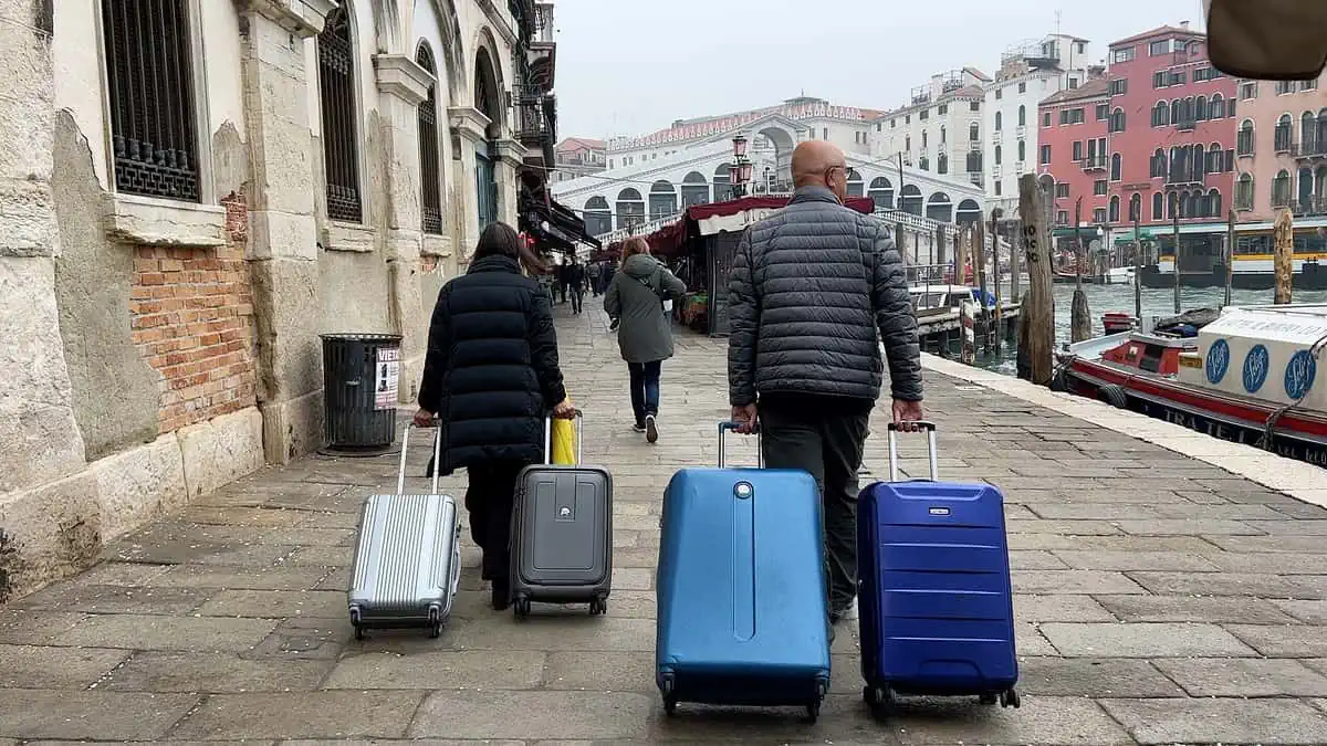 Carrying bags in Venice Italy